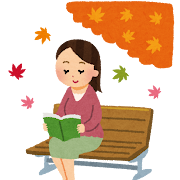 ベンチで読書をする女性のイメージ
